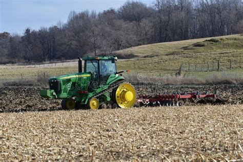 John Deere Tractor Plowing Field