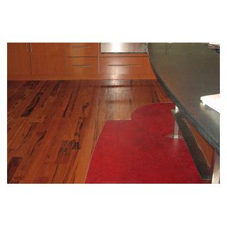 Tigerwood Flooring With A Marmoleum Inlay And Aluminum Feature Strip