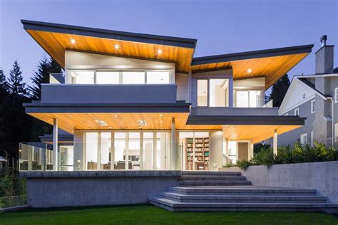 A Butterfly Roof And Dramatic Lighting Give This Home A Striking