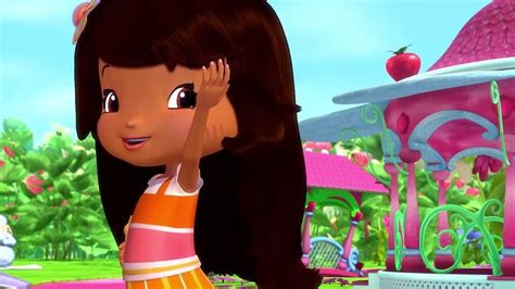 A Cartoon Girl In An Orange And White Dress Standing Next To A Pink