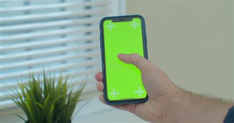 Man Using Vertical Smartphone With Green Screen Close Up Shot Of Man`s