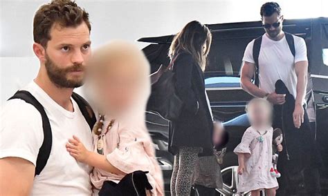 Jamie Dornan Carries Look A Like Daughter Dulcie At Lax Daily Mail Online