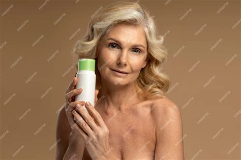 Premium Photo Confident Caucasian 50s Woman Holding Jar Of Antiaging