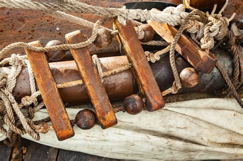 Premium Photo Old Ropes A Folded Sail And A Rope Ladder On The Wooden