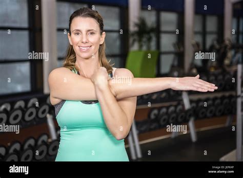 Smiling Blonde Stretching Her Arms Stock Photo Alamy