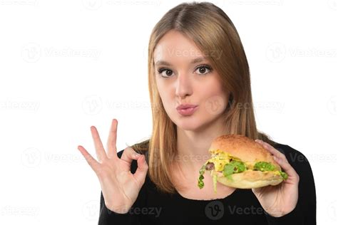 Portrait Of A Beautiful Funny Young Girl Eating Hamburger 15976610