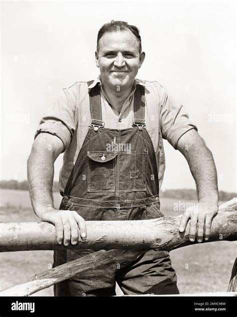 S Portrait Of Strong Self Possessed Man Farmer Wearing Denim Bib