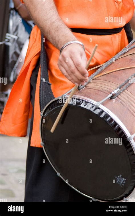 Dhol Indian Drum playing bhangra beats music Stock Photo - Alamy