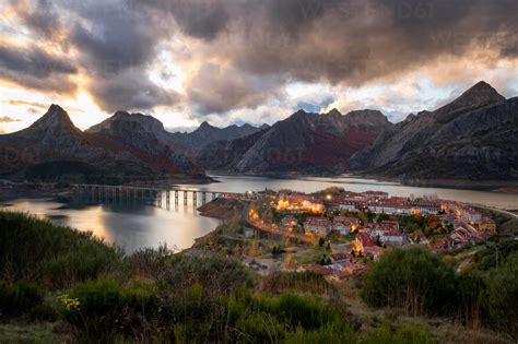 Riano Cityscape At Sunset With Mountain Range Landscape During Autumn