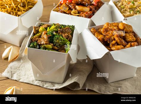 Spicy Chinese Take Out Food With Chopsticks And Fortune Cookies Stock