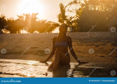 Pretty Beautiful Woman In Swimwear Bikini Posing In Blue Sea Water