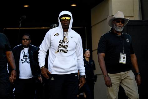 NFL icon and Colorado Buffaloes coach Deion Sanders looks almost ...