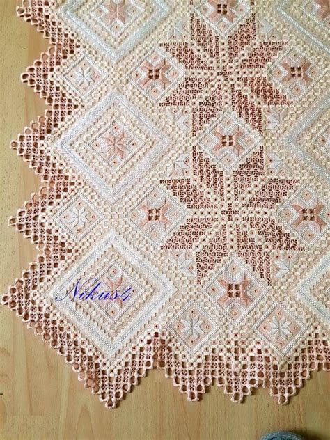 A Crocheted Doily On A Wooden Surface