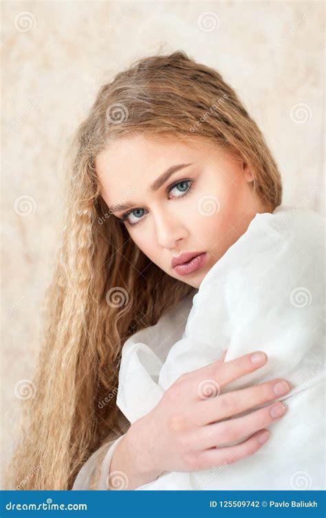 Portrait Of Pale Blonde Curly Hair In White Clothes Healthy Skin Face Texture Nude Make Up