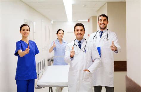 Happy Doctors Showing Thumbs Up At Hospital Stock Image Image Of