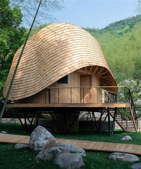 the undulating roof of this bamboo treehouse by monoarchi dictates its ...