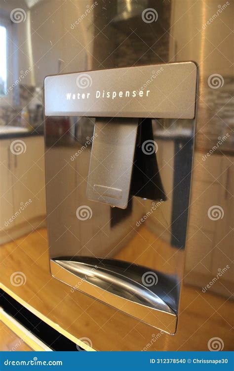 Grey Silver Coloured Water Dispenser from a Built in Fridge Stock Photo - Image of plastic ...