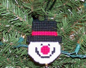 A Knitted Ornament Hanging From A Christmas Tree