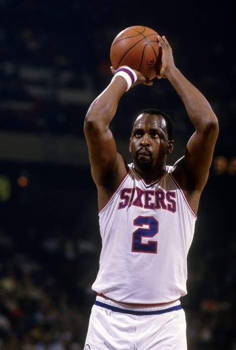 An Image Of A Basketball Player Holding A Ball In The Air With His Hands Up