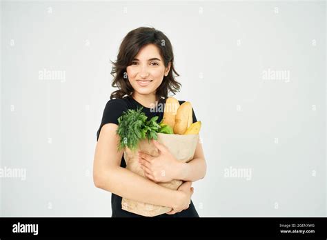 Brunette With A Package Of Groceries Healthy Food Supermarket Delivery Stock Photo Alamy