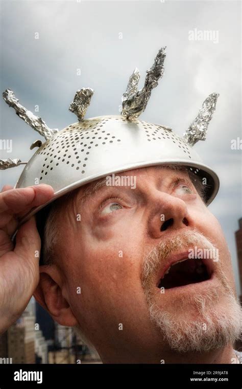 Man Wearing Tinfoil Hat Due To The Superstition Of Extraterrestrial