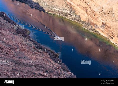 A powerboat on the Colorado River in Glen Canyon below the Glen Canyon ...