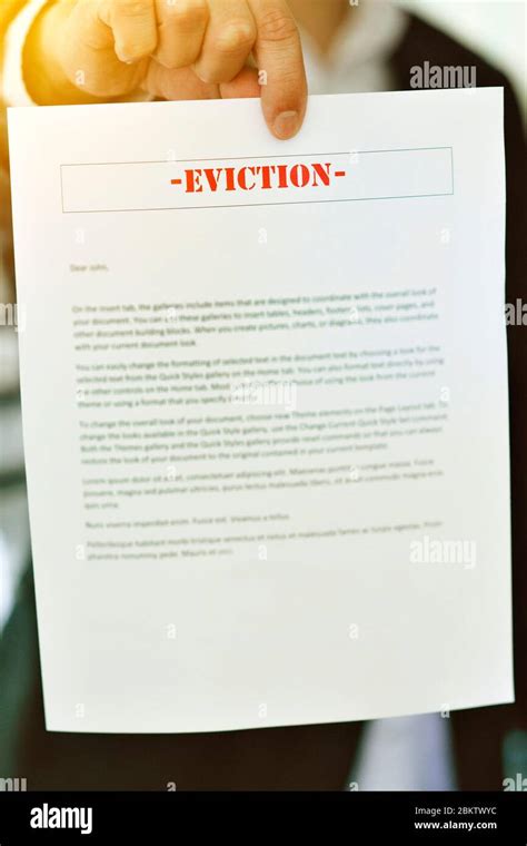 Someone Serving An Eviction Notice With Hands In View Late Rent