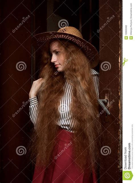 Pretty Young Red Haired Woman With Freckles In Straw Hat Posing Stock