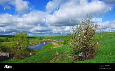 sunny spring landscape  river  beautiful clouds  blue sky