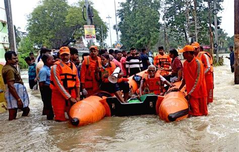 Ndrf Personnel Conduct A Rescue Operation In A Flooded Area After Heavy