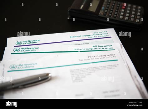 HMRC self assessment tax forms with pen and calculator Stock Photo - Alamy