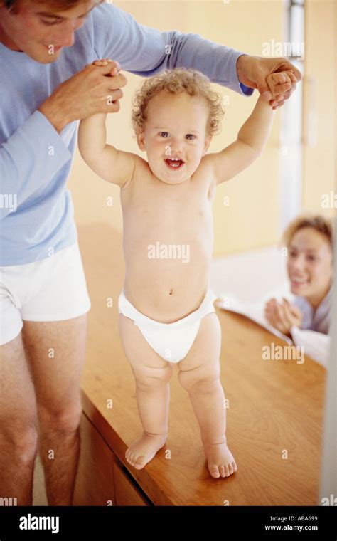 Baby's first steps Stock Photo - Alamy