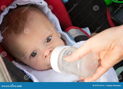 Funny baby drinking water stock photo. Image of bottle - 97917612