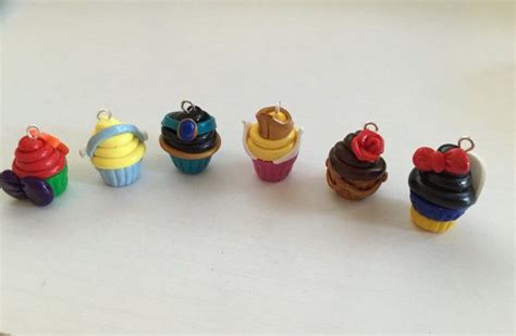 Small Toy Cupcakes Are Lined Up On A Table