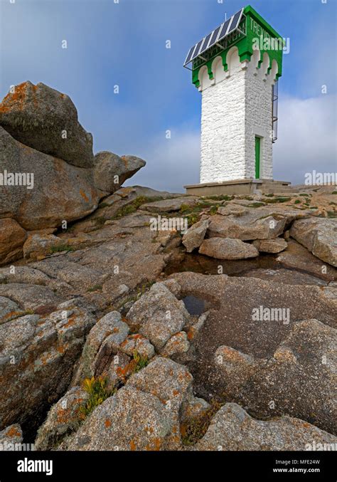 Green And White Lighthouse On Granite Rocks Pointe De Trevignon