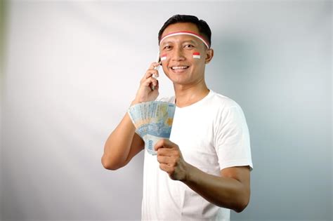 Premium Photo Adult Asian Man Smiling Happy While Holding Paper Money