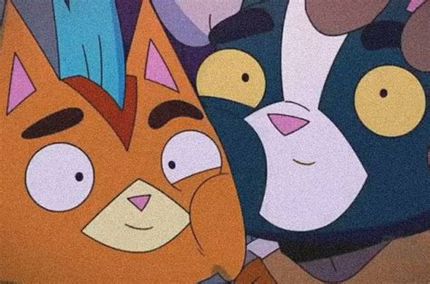 Two Cartoon Cats With Different Facial Expressions On Their Faces One