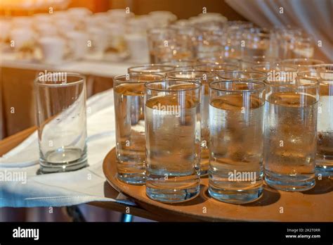 Many glasses of water on bar counter Stock Photo - Alamy