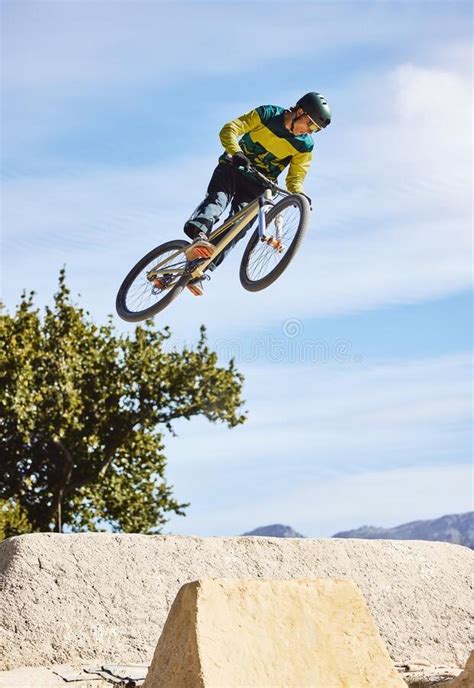 Man Cyclist And Mountain Biking In Free Style Tricks Or Extreme Hill