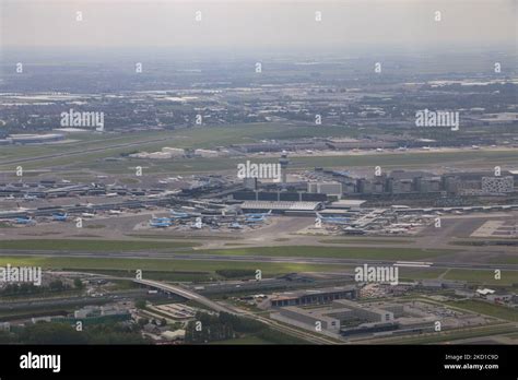 The Airport Terminal With Blue KLM Jet Planes And Others At The Gates