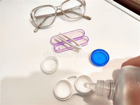 A Set For Contact Lenses With A Container Forceps Glasses The