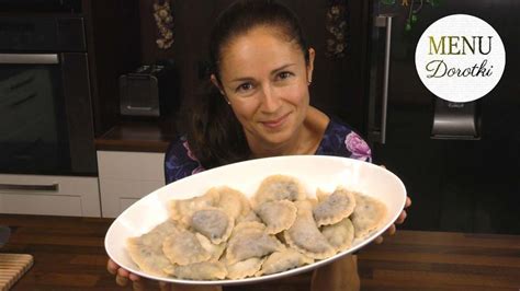 A Woman Holding Up A Plate Of Food