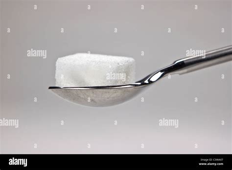 Piece Of Sugar Cubes On A Spoon Stock Photo Alamy