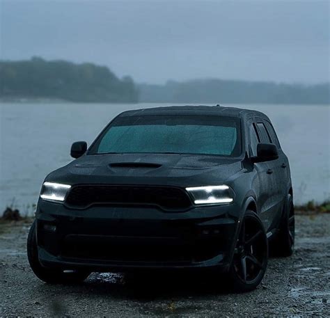 Black Dodge SUV by the Water