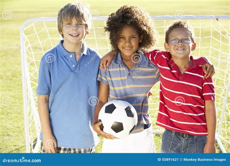 Young Boy with Soccer Ball Standing by Goal Stock Image - Image of ...