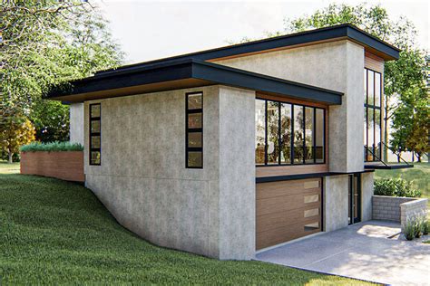 Striking Modern House Plan with Courtyard and Drive-Under Garage ...