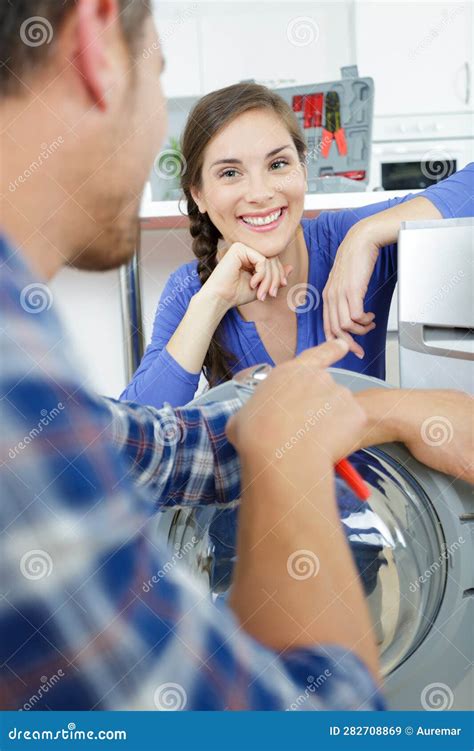 Man And Woman Flirting Next To Washing Machine Stock Image Image Of Teamwork Embracing 282708869