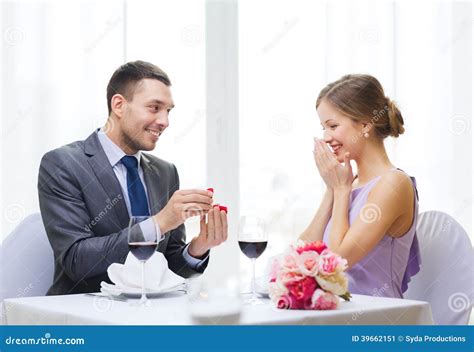 Man Proposing To His Girlfriend At Restaurant Stock Image Image Of