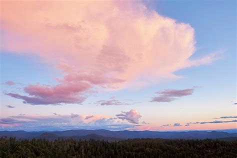 Pink Clouds Over Mountains at Sunset Photograph by Ben North - Fine Art America