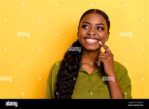 Portrait Of Attractive Cheerful Wavy Haired Girl Deciding Copy Blank